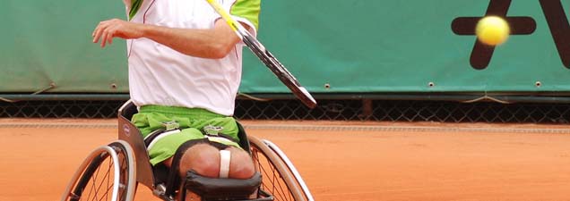 wheelchair user playing tennis